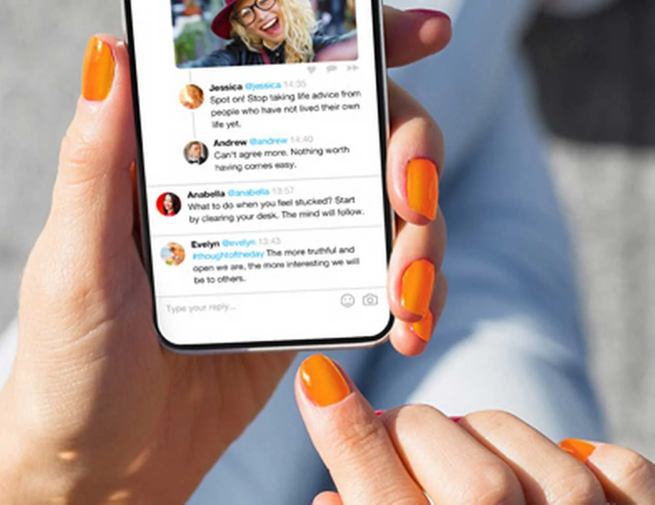 Close-up of a smartphone in a woman’s hands displaying an open social media app