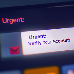 Close-up of a screen showing a message with the subject “Urgent: Verify Your Account”